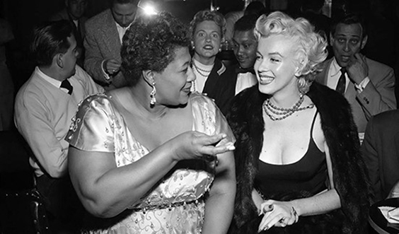 black and white image of ella fitzgerald and marilyn monroe talking